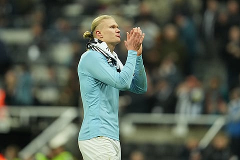 Manchester City's Erling Haaland walks off thne pitch atera Premier League soccer match between Newcastle United and Manchester City in Newcastle, England.