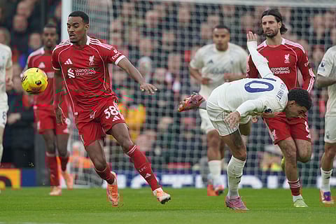 Liverpool's Ryan Gravenberch, left, challenges for the ball with Nottingham Forest's Morgan Gibbs-White during the English Premier League soccer match between Liverpool and Nottingham Forest in Liverpool, England.