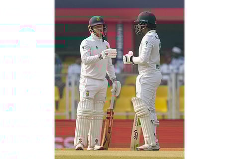 South Africa's Senuran Muthusamy and Kyle Verreynne during the day two of the second Test cricket match of a series between India and South Africa, at ACA Stadium in Guwahati.