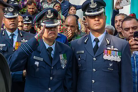 Wing Commander Afshan Akhtar, wife of Indian Air Force (IAF) Wing Commander Namansh Syal, who was killed during an aerial display at the Dubai Air show, salutes as his mortal remains are being brought to his ancestral home, in Dharamshala, Himachala Pradesh.