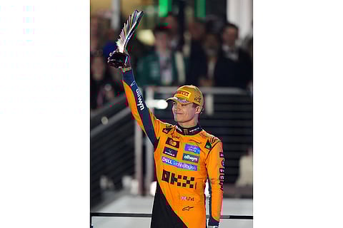 Second place finisher McLaren driver Lando Norris of Great Britain celebrates with his trophy after the Formula One Las Vegas Grand Prix auto race in Las Vegas.