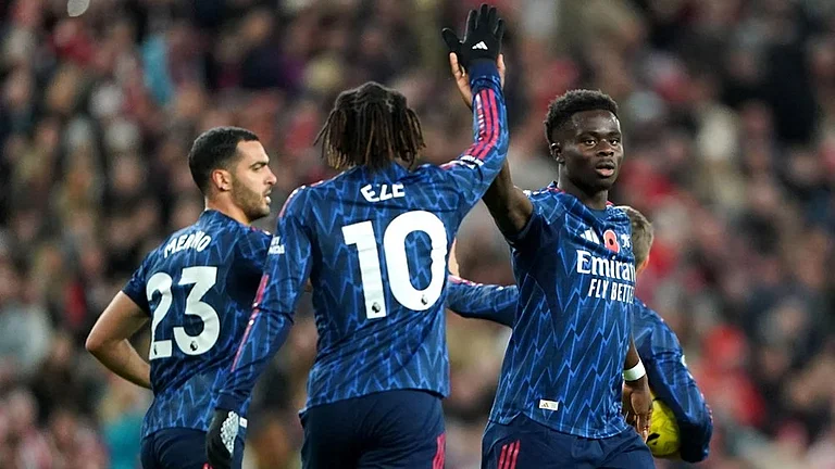 Arsenal's Bukayo Saka (right) celebrates scoring their side's first goal during the English Premier League soccer match between Arsenal and Sunderland, in Sunderland, England. - | Photo: Owen Humphreys/PA via AP