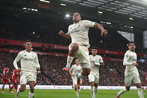 Nottingham Forest's Murillo, centre, celebrates after scoring his side's opening goal during the English Premier League soccer match between Liverpool and Nottingham Forest in Liverpool, England.