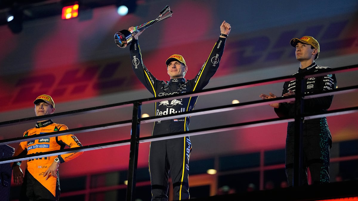 From left, second place finisher McLaren driver Lando Norris of Great Britain, first place finisher Red Bull driver Max Verstappen of the Netherlands, and third place finisher Mercedes driver George Russell of Great Britain. - AP/John Locher