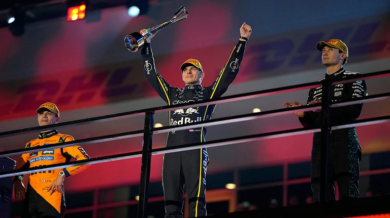 From left, second place finisher McLaren driver Lando Norris of Great Britain, first place finisher Red Bull driver Max Verstappen of the Netherlands, and third place finisher Mercedes driver George Russell of Great Britain. - AP/John Locher