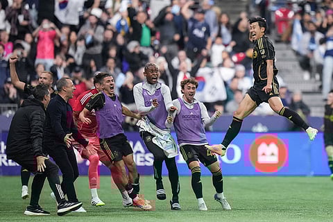 Los Angeles FC's Son Heung-min, front right, celebrates his second goal against the Vancouver Whitecaps during the second half of the MLS Western Conference semifinal playoff soccer match, in Vancouver, British Columbia.