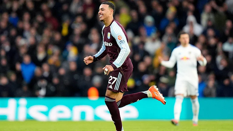 Aston Villa's Morgan Rogers celebrates scoring their side's first goal of the game during the English Premier League match against Leeds United on November 23, 2025. - | Photo: AP/Danny Lawson