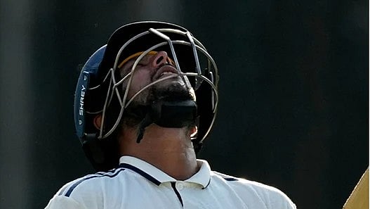 | Photo: AP/Anupam Nath : India's Kuldeep Yadav walks off the field after losing his wicket on the third day of the second cricket test match between India and South Africa in Guwahati.