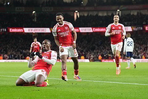 Arsenal's Eberechi Eze celebrates after scoring during a Premier League soccer match between Arsenal and Tottenham in London.