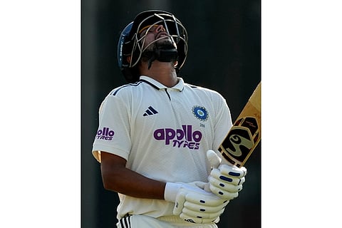 India's Kuldeep Yadav walks off the field after losing his wicket on the third day of the second cricket test match between India and South Africa in Guwahati.