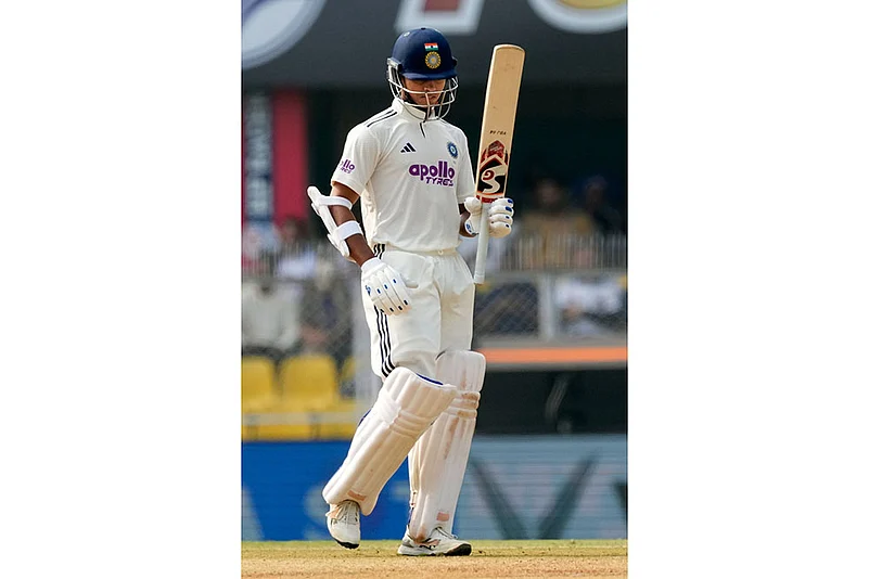 Yashasvi Jaiswal celebrates after scoring fifty runs