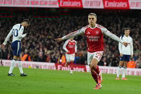 Arsenal's Leandro Trossard celebrates after scoring during a Premier League soccer match between Arsenal and Tottenham in London.
