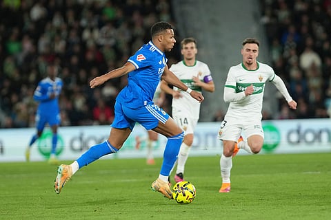 Real Madrid's Kylian Mbappe controls the ball during the Spanish La Liga soccer match between Elche and Real Madrid in Elche, Spain.