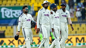 AP Photo/Anupam Nath : India's players walk off the field at the end of the third day of the second cricket test match between India and South Africa in Guwahati, India, Saturday, Nov. 22, 2025.