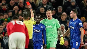AP : Everton's Idrissa Gueye, third right, gets a red card from referee Tony Harrington during the English Premier League match between Manchester United and Everton at Old Trafford.