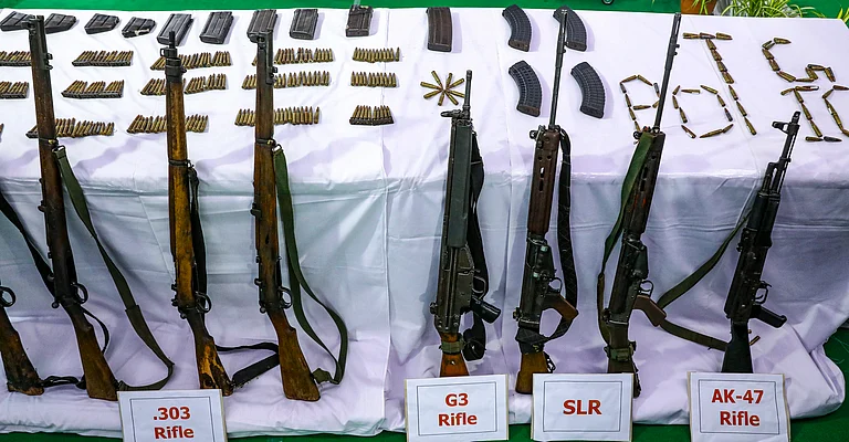A cache of arms put down by maoists after their surrender. - A. Suresh Kumar/PTI