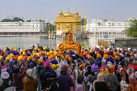 Members of the Sikh community take part in a 'Nagar Kirtan' procession commemorating the 350th anniversary of the martyrdom of the 9th Sikh Guru, Guru Tegh Bahadur, at Golden Temple in Amritsar.