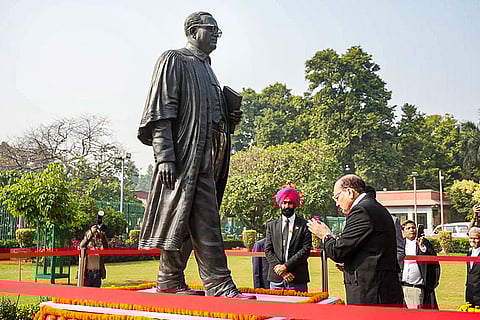 Newly sworn-in Chief Justice of India Surya Kant pays tribute to Mahatma Gandhi at the Supreme Court premises, in New Delhi. 