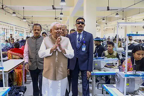 Bihar Chief Minister Nitish Kumar visits a textile factory during his tour of an industrial area, in Hajipur.