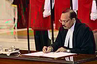 PTI : Nov. 24, 2025, Justice Surya Kant signs the documents after taking oath as the 53rd Chief Justice of India (CJI), at Rashtrapati Bhavan in New Delhi