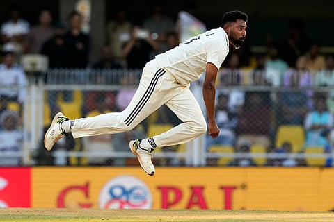 India's Mohammed Siraj bowls a delivery on the third day of the second cricket test match between India and South Africa in Guwahati.