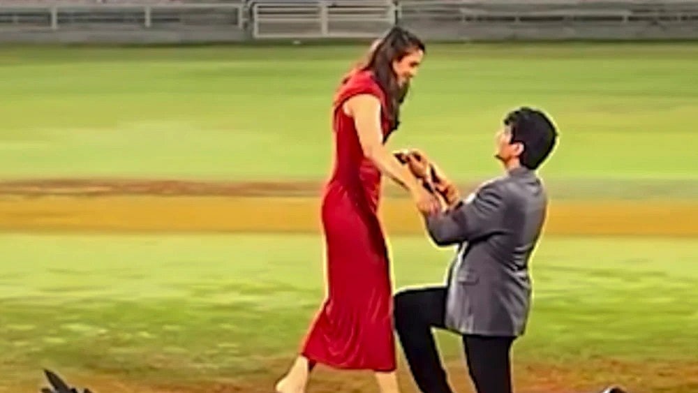 | Photo: @palash_muchhal/Instagram via PTI : World Cup-winning Indian women's cricket team star Smriti Mandhana being proposed by music composer Palash Mucchal for marriage at the DY Patil Stadium, in Navi Mumbai. 