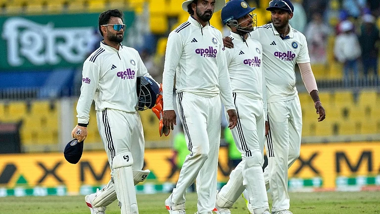 India's players walk off the field at the end of the third day of the second cricket test match between India and South Africa in Guwahati, India, Saturday, Nov. 22, 2025. - AP Photo/Anupam Nath