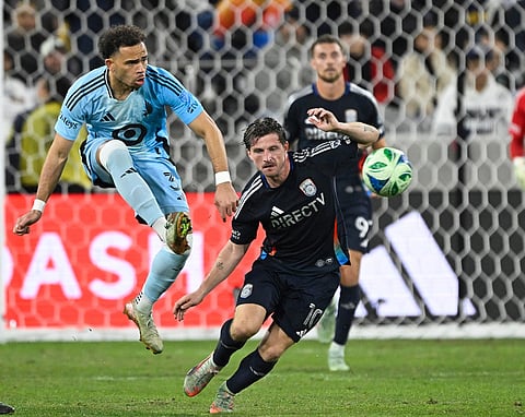 Minnesota United midfielder Hassani Dotson (31) passes in front of San Diego FC midfielder Anders Dreyer (10) during the second half of MLS soccer's Western Conference semifinal in San Diego.