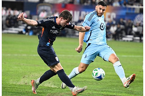 San Diego FC midfielder Anders Dreyer (10) shoots past Minnesota United defender Michael Boxall (15) during the second half of MLS soccer's Western Conference semifinal in San Diego. 