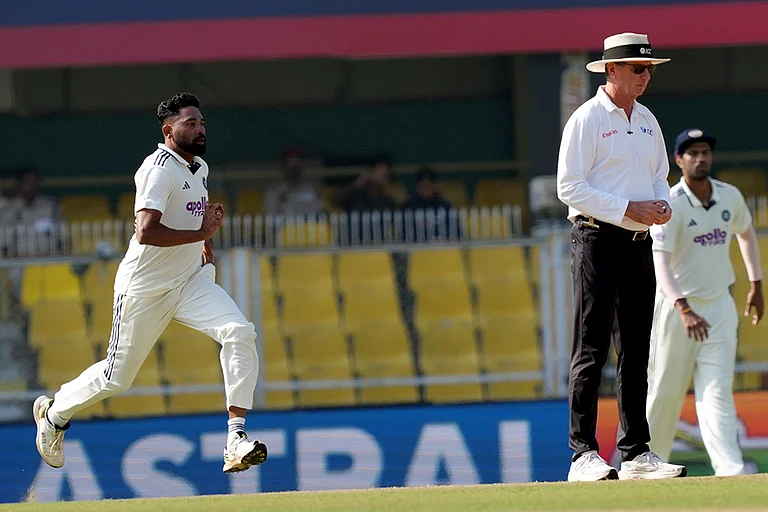 India's Mohammed Siraj bowls a delivery during the fourth day of the second Test cricket match between India and South Africa, at ACA Stadium, Barsapara in Guwahati. - | Photo: PTI/Shahbaz Khan