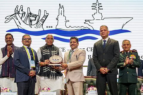 Union Defence Minister Rajnath Singh presents award to CMD of Garden Reach Shipbuilders & Engineers (GRSE) Cmde PR Hari, IN Retd., right, during 'Samudra Utkarsh', a seminar on shipbuilding strength and maritime innovation, organised by the Department of Defence Production at Bharat Mandapam, in New Delhi. GRSE Director Planning Captain IN P Sunilkumar Retd., Chief of Defence Staff General Anil Chauhan and others are also present. 