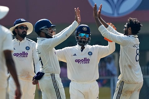 India's players celebrate the dismissal of South Africa's Tony de Zorzi on the fourth day of the second cricket test match between India and South Africa in Guwahati.