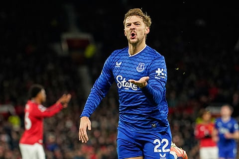 Everton's Kiernan Dewsbury-Hall celebrates after scoring the opening goal during the English Premier League soccer match between Manchester United and Everton in Manchester, England.