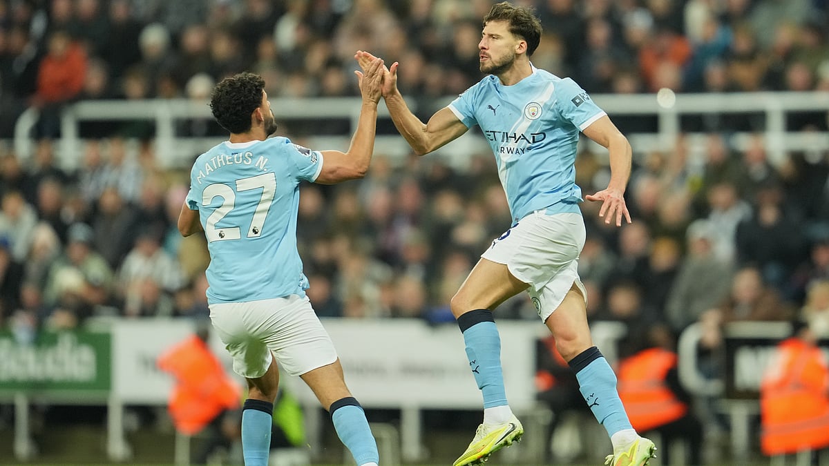 Manchester City's Matheus Nunes and Ruben Dias celebrate after scoring during the English Premier League match against Newcastle United on November 22, 2025. - | Photo: AP/Jon Super