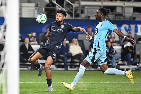 San Diego FC midfielder Anibal Godoy (20) shoots past Minnesota United forward Kelvin Yeboah (9) during the first half of MLS soccer's Western Conference semifinal in San Diego. 