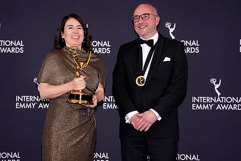 Claudia Bluemhuber and Matt Hastings, winners in the Kids: Live-Action category for "Fallen," appear in the press room during the 53rd International Emmy Awards at the New York Hilton Midtown in New York. 