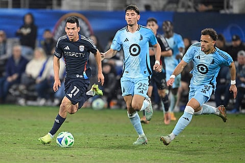 San Diego FC midfielder Hirving Lozano (11) breaks away from Minnesota United defender Nectarios Triantis (25) and Hassani Dotson (31) during the second half of MLS soccer's Western Conference semifinal in San Diego. 