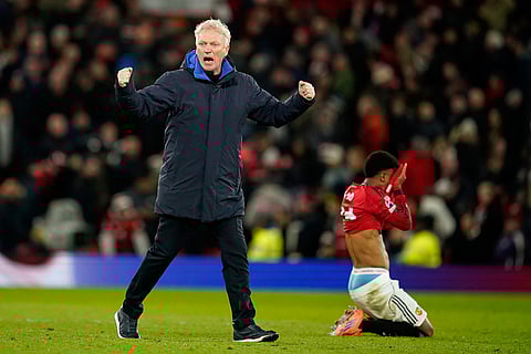 Everton's head coach David Moyes celebrates after the English Premier League soccer match between Manchester United and Everton in Manchester, England.