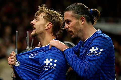 Everton's Kiernan Dewsbury-Hall, left, celebrates with Jack Grealish after scoring the opening goal during the English Premier League soccer match between Manchester United and Everton in Manchester, England.