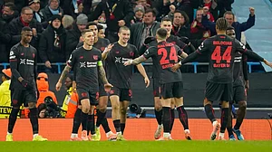 | Photo: AP/Dave Thompson : Bayer Leverkusen's Patrik Schick is congratulated by teammate Aleix Garcia, after he scored his sides second gaol during the UEFA Champions League opening phase match against Manchester City on November 25, 2025.