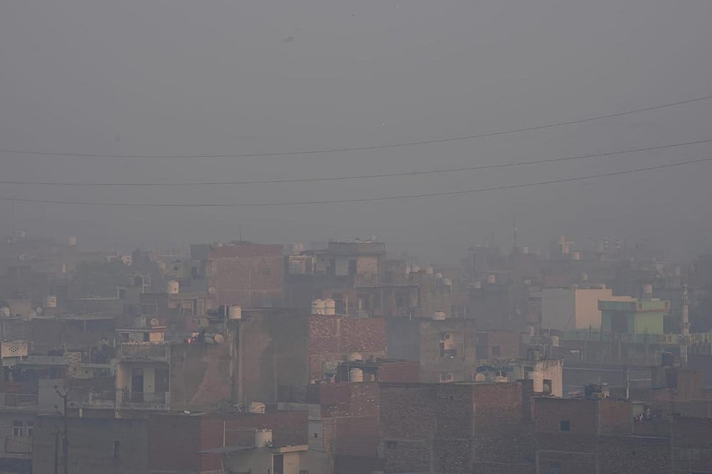 A thick blanket of smog covers an area as air quality deteriorates, in New Delhi. - | Photo: Suresh K Pandey/Outlook