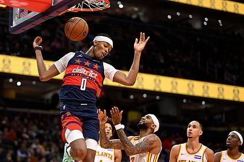 Washington Wizards guard Bilal Coulibaly (0) dunks during the first half of a Emirates NBA Cup basketball game against the Atlanta Hawks Tuesday, Nov. 25, 2025, in Washington. ()
