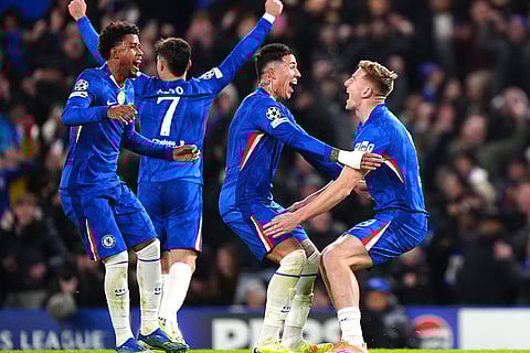 Chelsea's Liam Delap, right, celebrates scoring his side's third goal of the game with teammates during the Champions League opening phase soccer match between Chelsea and Barcelona in London, England.