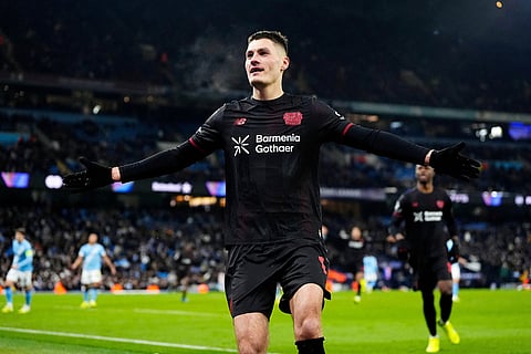 Leverkusen's Patrik Schick celebrates after scoring his side's second goal during the Champions League opening phase soccer match between Manchester City and Bayer Leverkusen in Manchester, England.