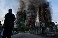 AP Photo/Chan Long Hei : Smoke rises after a fire broke out at Wang Fuk Court, a residential estate in the Tai Po district of Hong Kong's New Territories on Wednesday, Nov. 26 2025.
