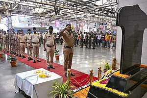 | Photo: PTI : Police personnel pay tribute to the victims of the 26/11 Mumbai terror attack on the attack's 17th anniversary, at Chhatrapati Shivaji Maharaj Terminus (CSMT) in Mumbai.