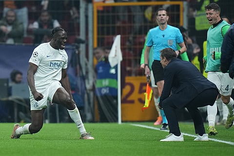 Union SG's Promise David, left, celebrates with Union SG's head coach Sebastien Pocognoli, after scoring the opening goal during the Champions League opening phase soccer match between Galatasaray and Union Saint-Gilloise, in Istanbul, Turkey.