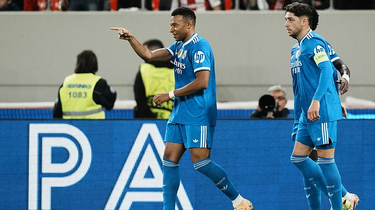 Real Madrid's Kylian Mbappe celebrates scoring his side's third goal during the UEFA Champions League opening phase match against Olympiacos on November 26, 2025. - | Photo: AP/Thanassis Stavrakis