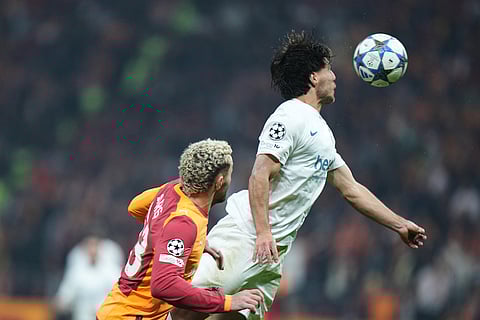 Union SG's Kevin Mac Allister, right, goes for a header against Galatasaray's Baris Yilmaz during the Champions League opening phase soccer match between Galatasaray and Union Saint-Gilloise, in Istanbul, Turkey.