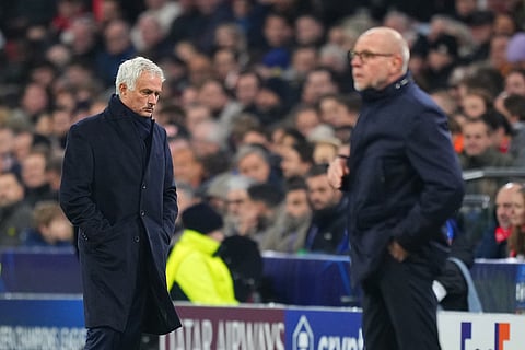 Benfica's head coach Jose Mourinho, left, and Ajax's head coach Fred Grim during the Champions League opening phase soccer match between Ajax and SL Benfica in Amsterdam, Netherlands.